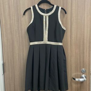 Endless Rose black pleated mini dress, faux diamond trim. Peekaboo cleavage.